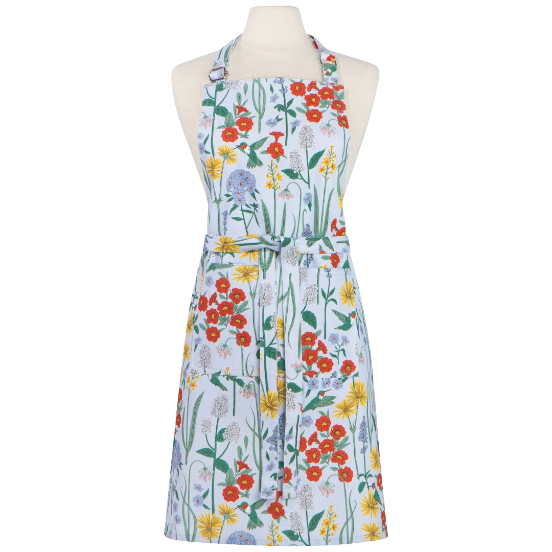 Floral apron on a mannequin with a colorful pattern of flowers on a light blue background