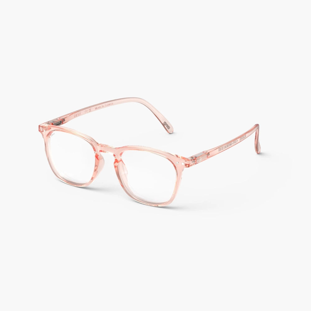 A pair of pink trapezoid-shaped IZIPIZI #E reading glasses sporty blush.