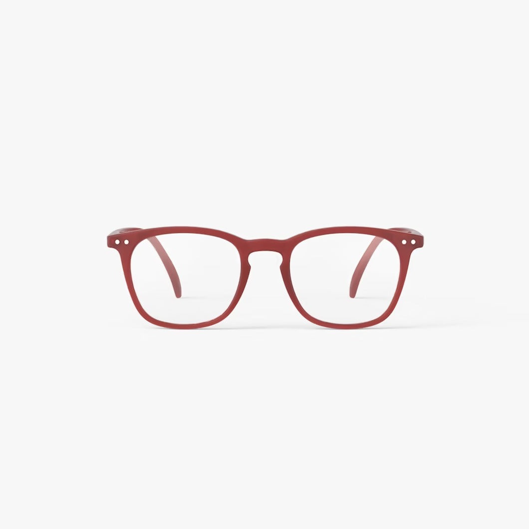 Red eyeglasses on a white background