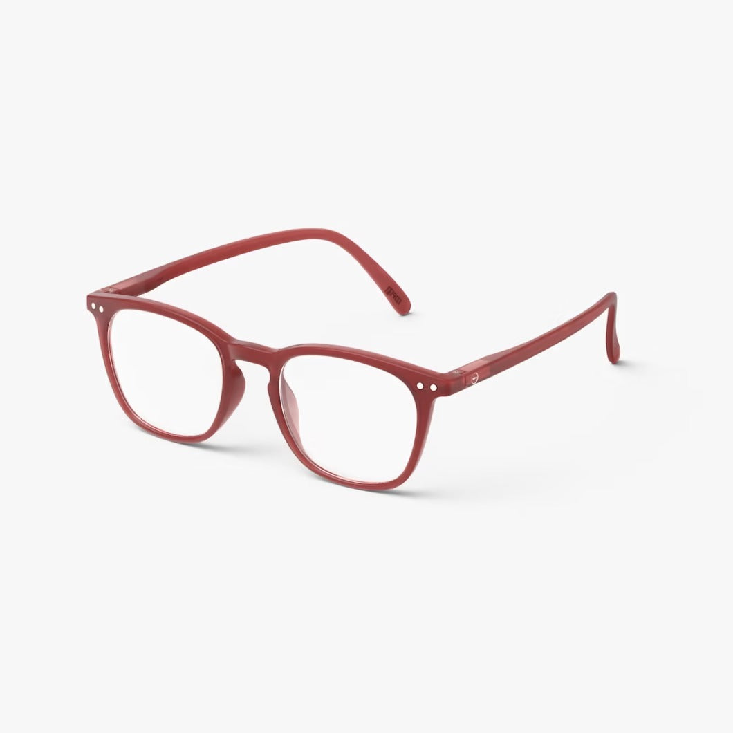 Red eyeglasses on a white background