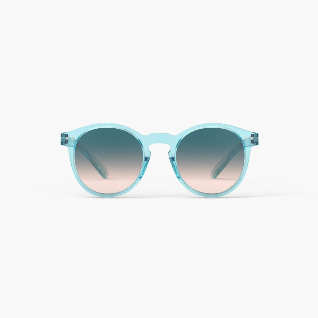 Light blue sunglasses with gradient lenses on a white background