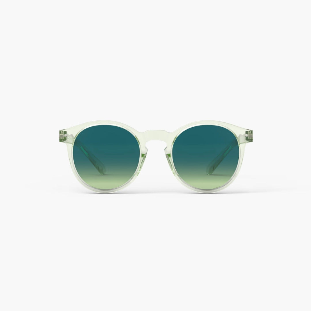Sunglasses with green gradient lenses on a white background