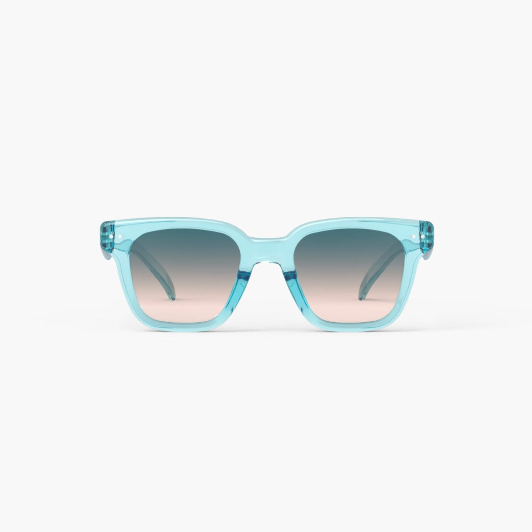 Blue sunglasses with gradient lenses on a white background