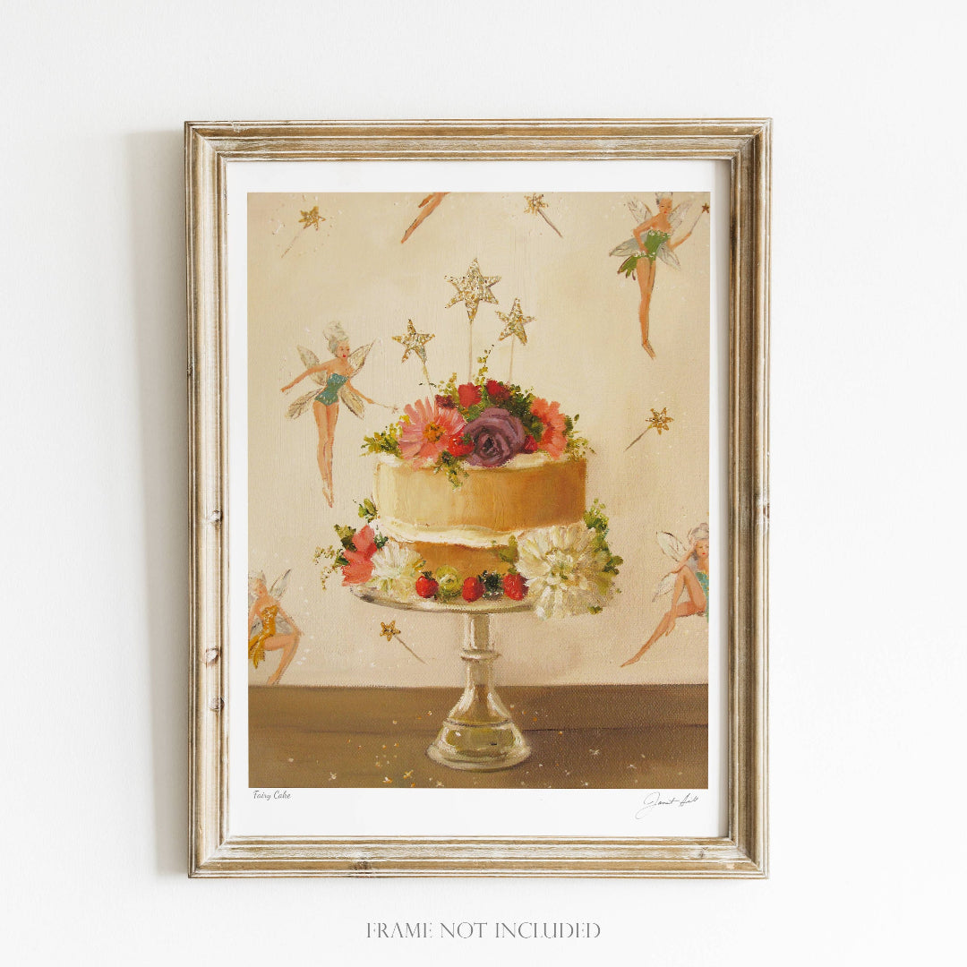 A framed art print of a fairy cake with decorative elements like stars and flowers, set against a neutral background.
