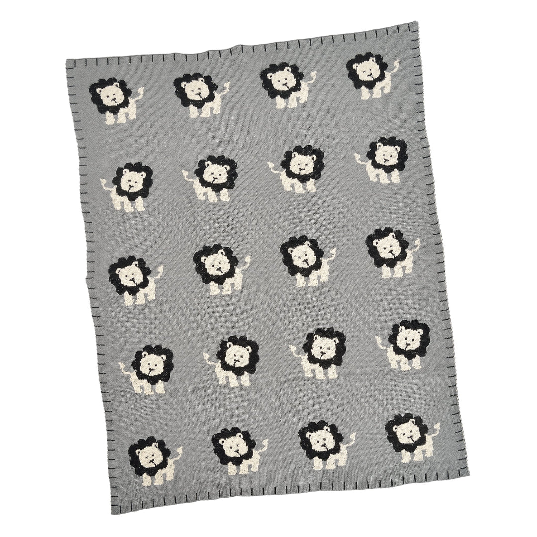 A gray cotton baby blanket with a pattern of black and white lion designs.