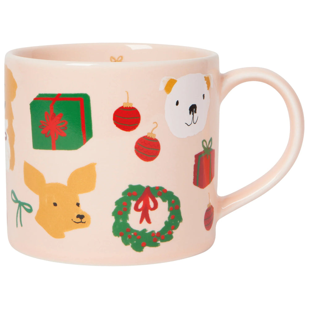 Mug with Christmas-themed illustrations including dogs, wreaths, and presents on a light pink background.