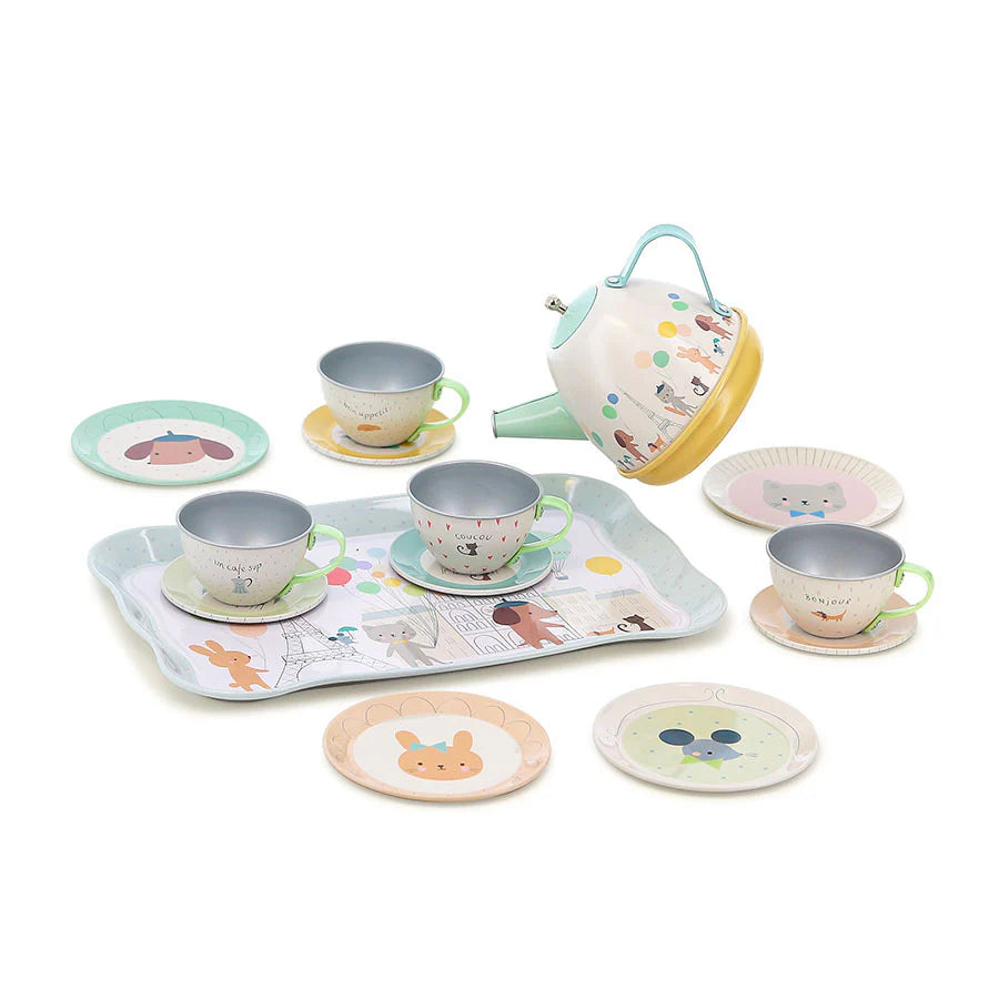 Children's tea set with teapot, cups, and plates on a white background
