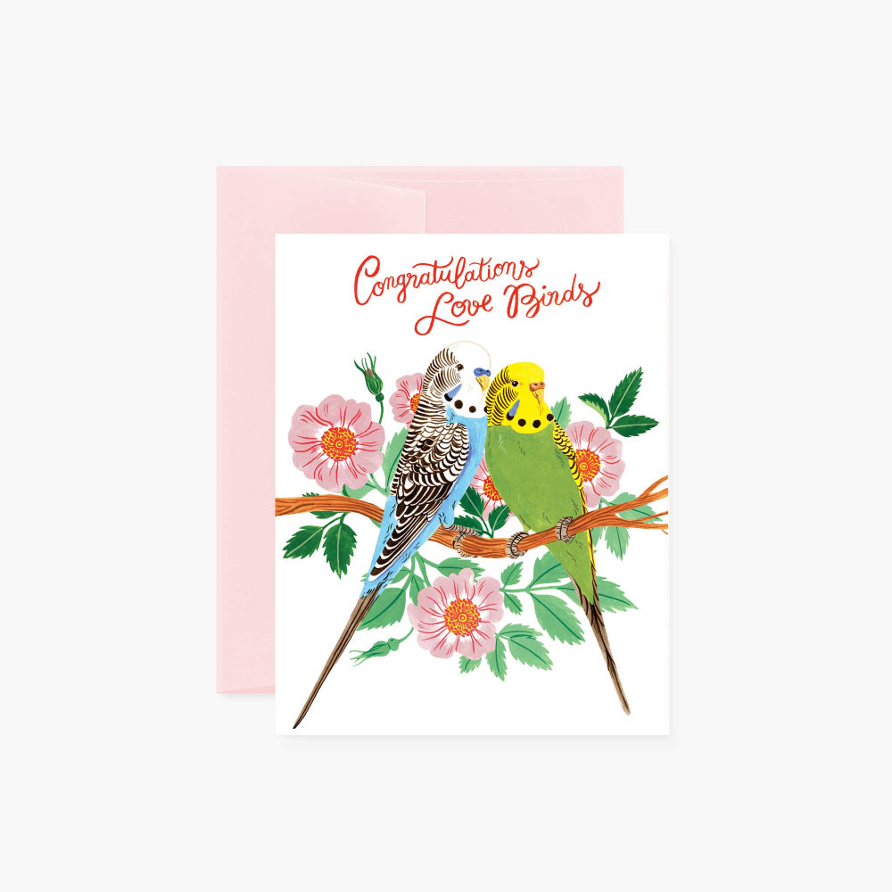 A congratulations card with an illustration of two lovebirds birds, flowers, and the text 'CONGRATULATIONS' in a circular pink background.