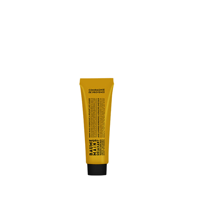 A yellow tube of hand balm with black text and detailing, displaying information likely related to the product's ingredients and usage.