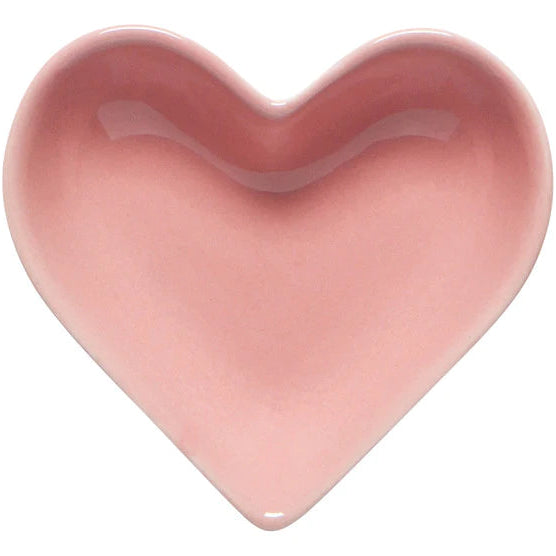 Pink heart-shaped object on a white background