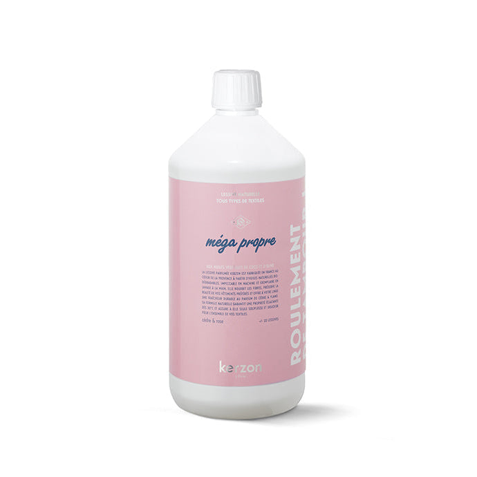 A bottle of Kerzon Mégé Propre Fragranced Laundry Soap in white color with a pink label.