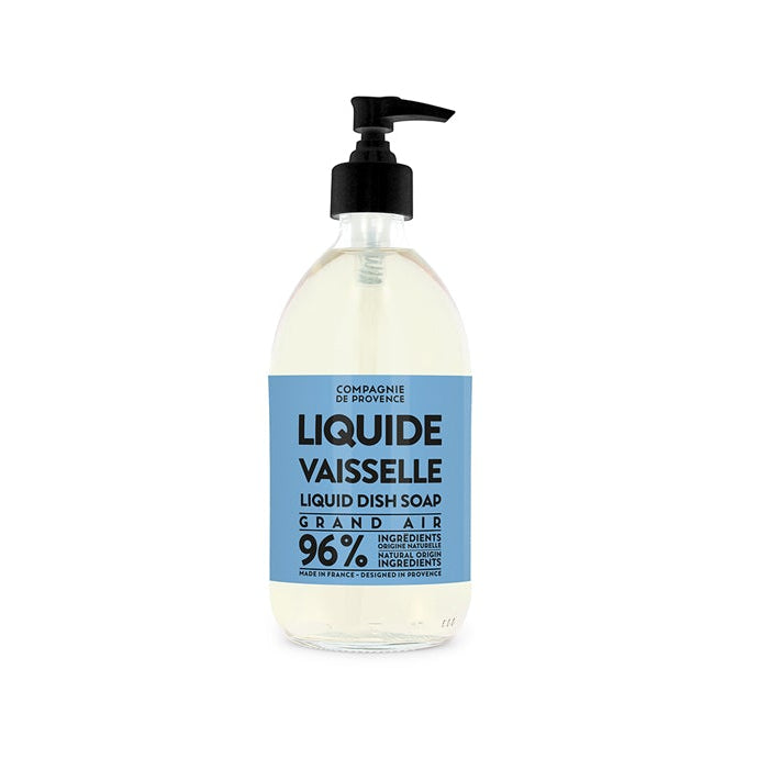 A clear pump bottle of dish soap with a label that reads 'Liquide Vaisselle,' indicating it is a liquid dish soap.