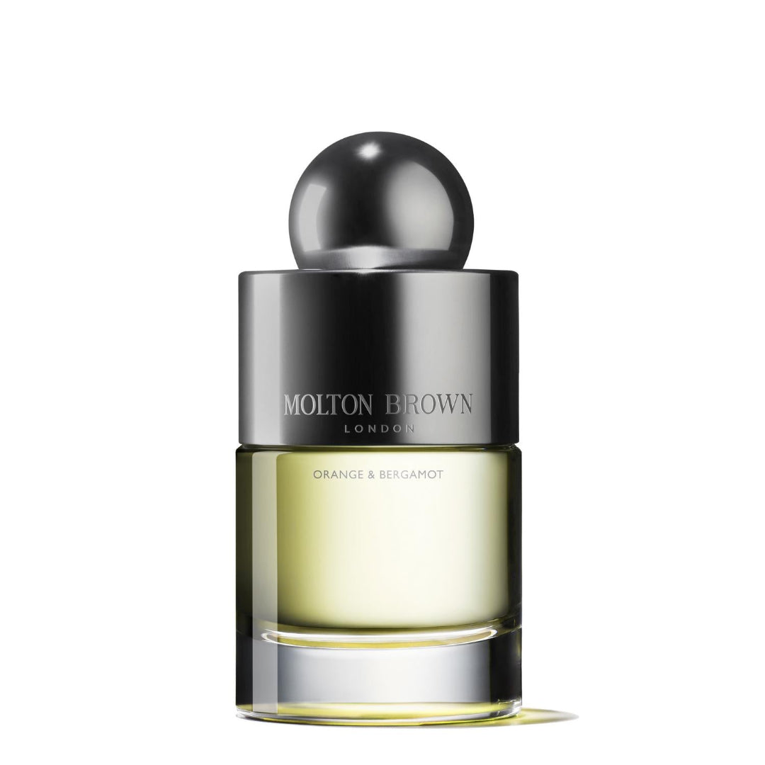 A bottle of Molton Brown Orange & Bergamot Eau de Toilette with a black and silver design.