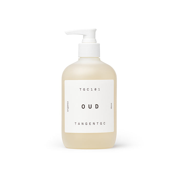A clear pump bottle with a white label that displays 'Tangent Oud' and the scent marked as 'Oud'.