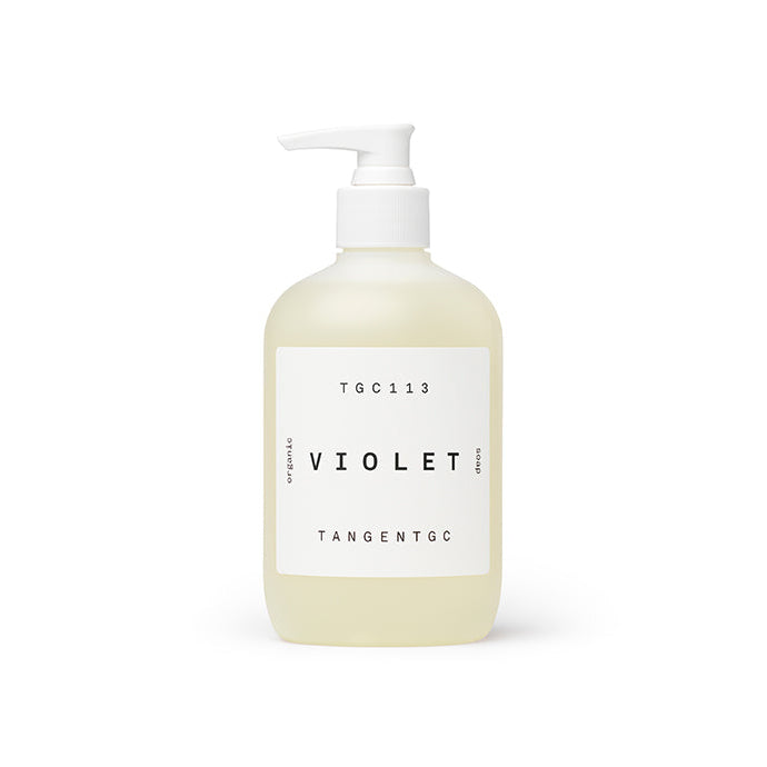 A clear pump bottle with a white label, labeled 'TANGENT GC' and 'VIOLET' indicating the soap fragrance.