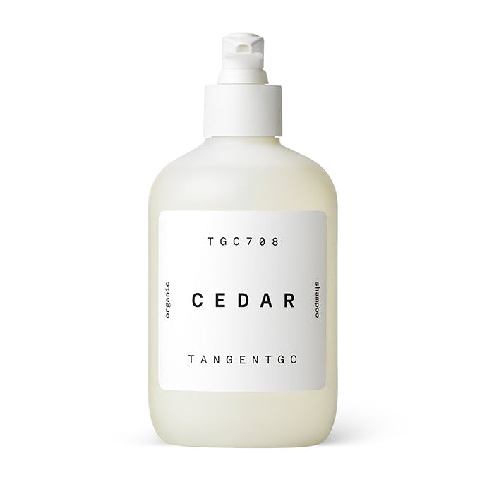 A bottle of Tangent GC Cedar shampoo with a white pump dispenser, labeled with the brand and product name, on a plain background.
