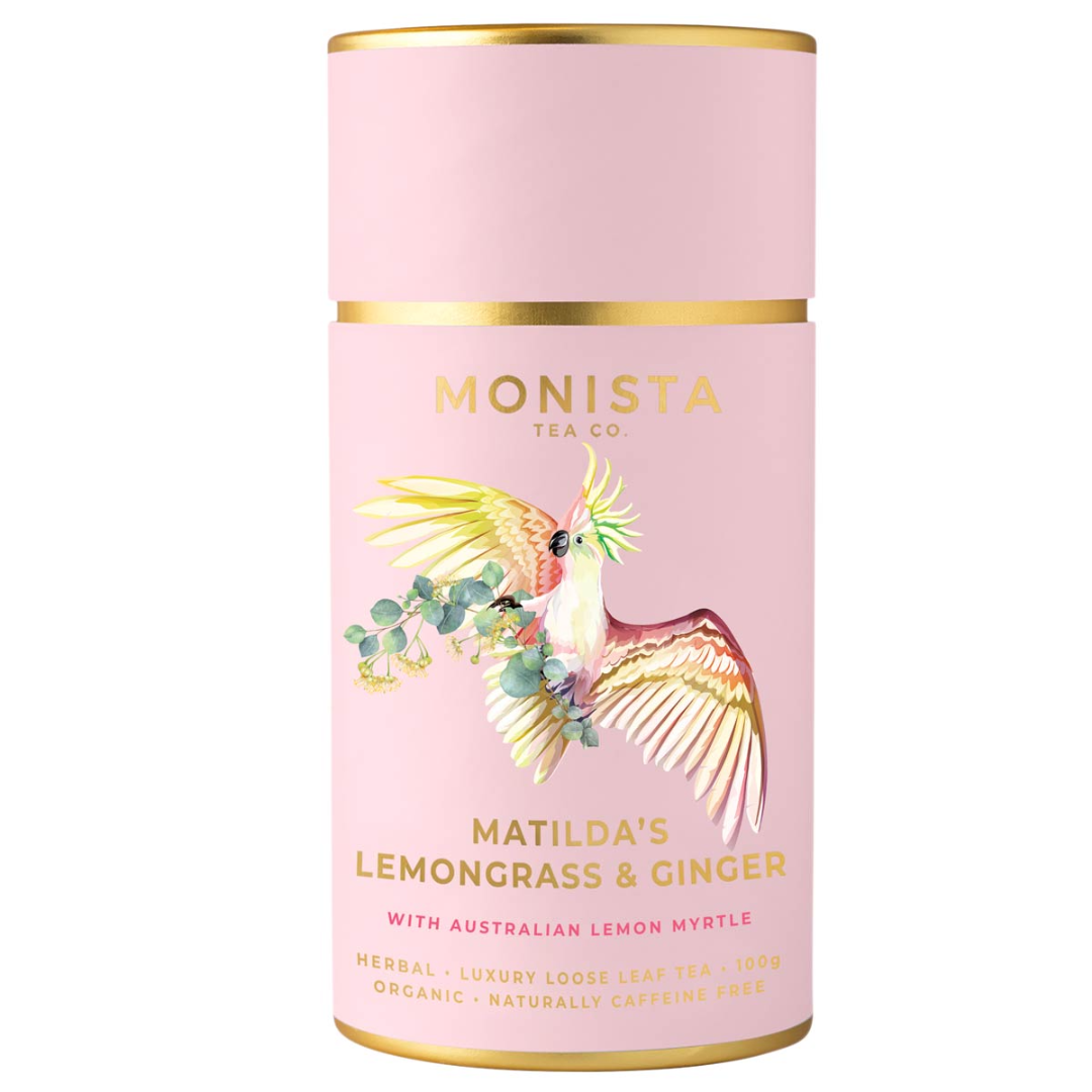Pink tea canister with gold accents and bird illustration, featuring Monista Tea Co. branding.
