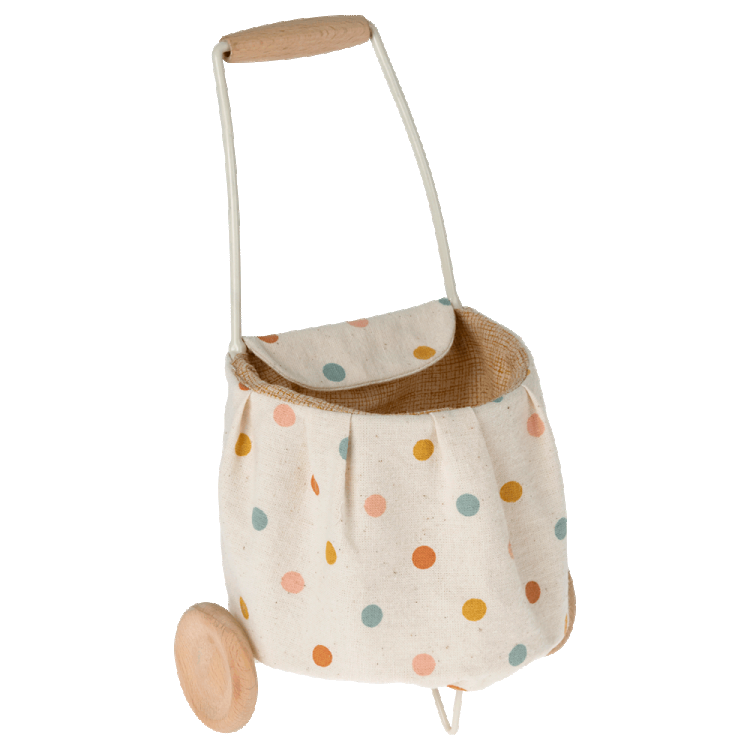 A beige linen fabric trolley with multicolored dots, including a handle and wheels, designed for toy use.